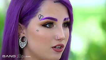 A Young Girl With Purple Hair And Piercings Engages In A Threesome With Two Men, Filmed In A Raw And Beautiful Manner